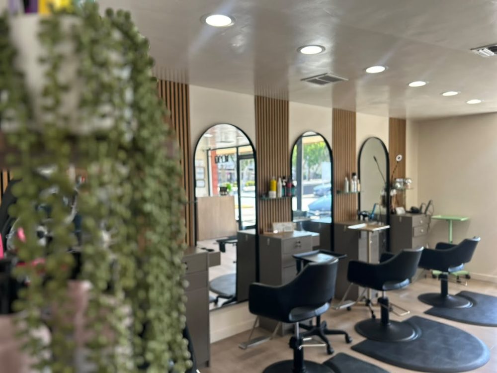 Inside the salon, styling stations with arched mirrors and warm wood accents, Hair Palette Beauty Salon, El Cajon