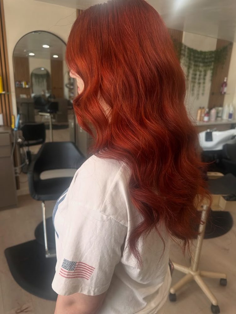 Vibrant copper-red hair color on long, glossy waves, Hair Palette Beauty Salon, El Cajon