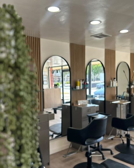 Inside Hair Palette Beauty Salon, styling stations with arched mirrors