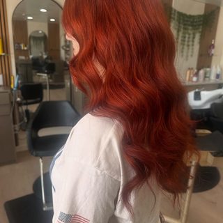 Vibrant copper-red hair color by Hair Palette Beauty Salon