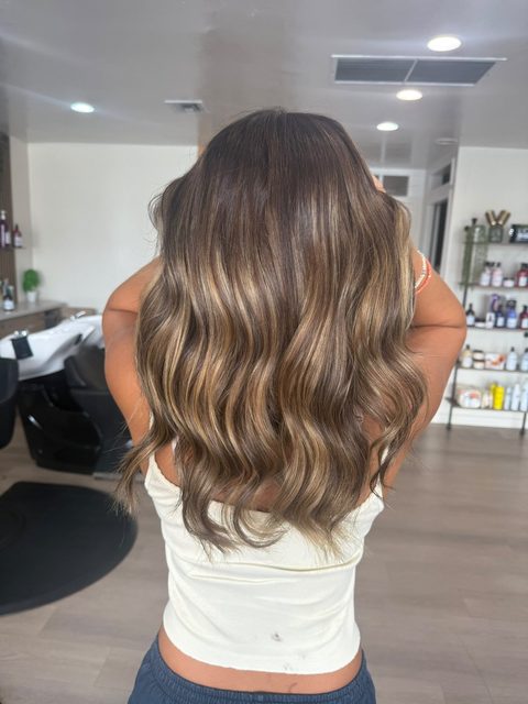 Bronde balayage melting from brown to blonde on beachy waves